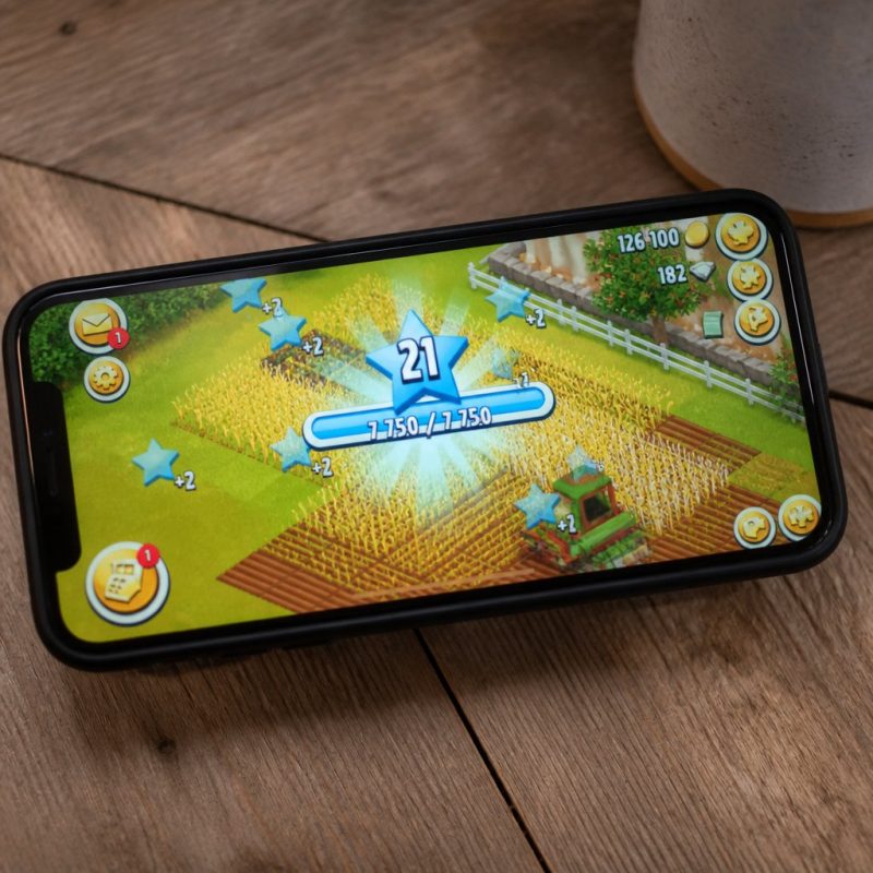 Hay Day XP level-up screen with a crop field visible in the